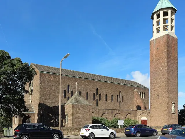 The exterior of a mid-twentieth-century brick church building on a residential street.