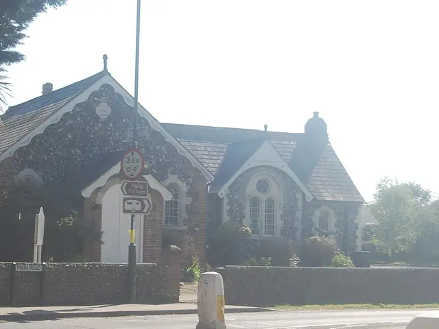 Exterior of Yapton Evangelical Free Church, a flint and brick building with a decorative gable, in Yapton, West Sussex, England.
