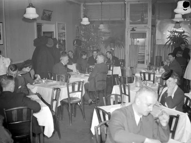 A vintage photograph of customers seated at tables inside a restaurant in Montreal.