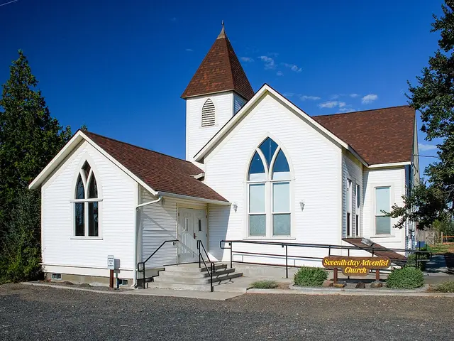 White wood-frame Seventh-day Adventist church with a small steeple in the rural community of Umapine, Oregon.