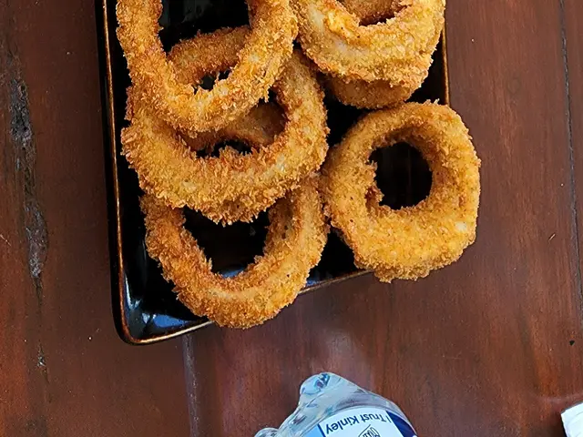 Deep-fried onion rings in a crispy batter.