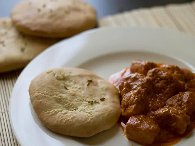 A serving of murgh makhani, also known as butter chicken, an Indian curry dish.