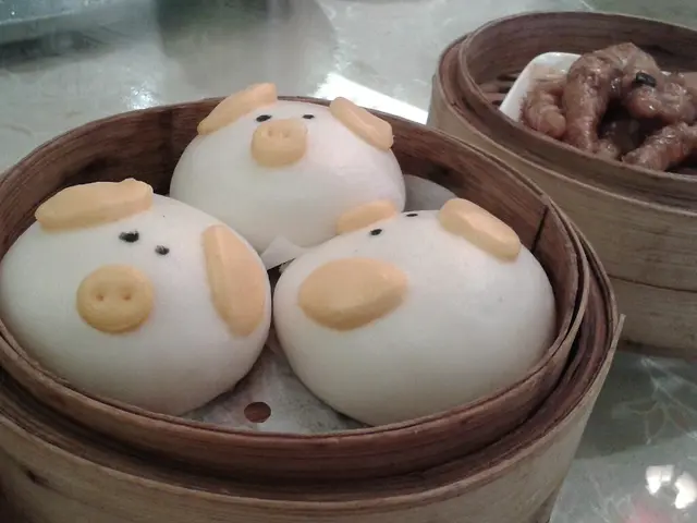 An assortment of small steamed dim sum dishes served in steamer baskets.