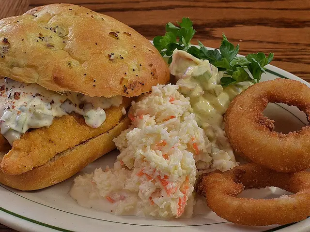 Breaded chicken tenders on a plate.