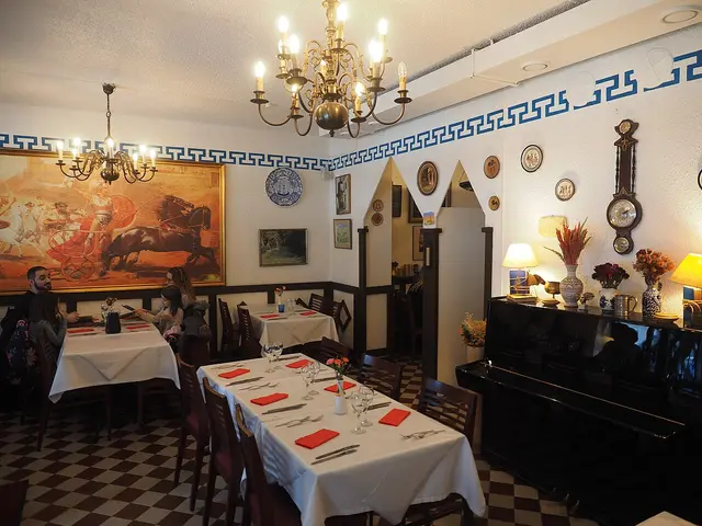 Interior dining area of a Greek restaurant.