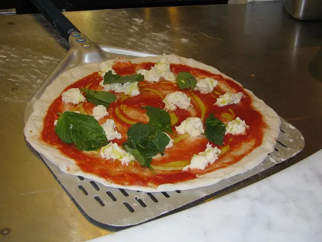 An uncooked Neapolitan-style pizza before baking.