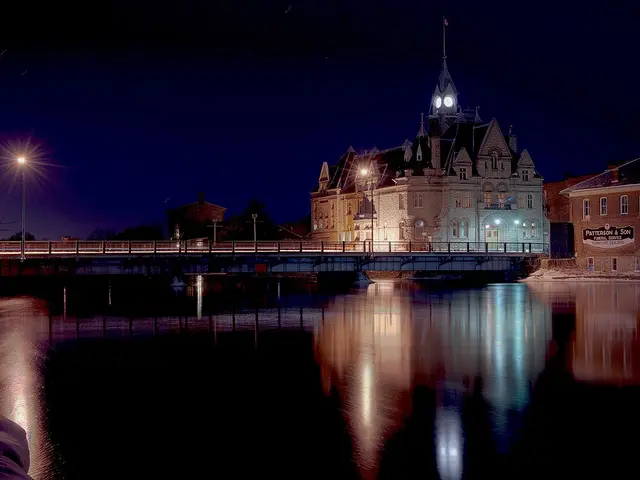 Carleton Place Town Hall on the bank of the Mississippi River, at night.