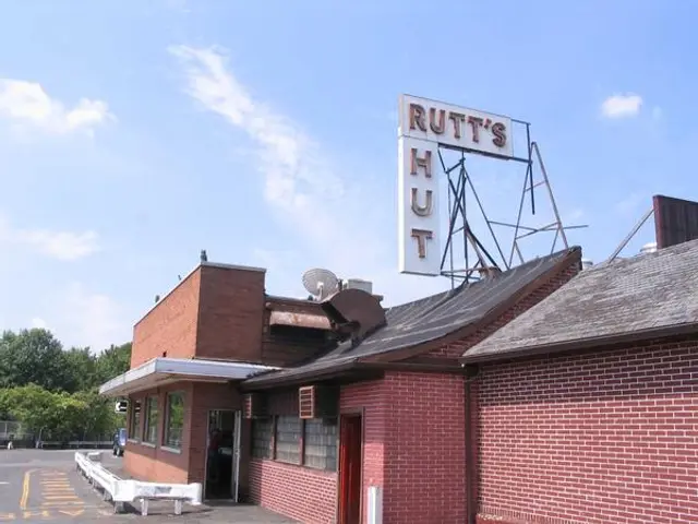 Exterior of a small independent hot dog restaurant.