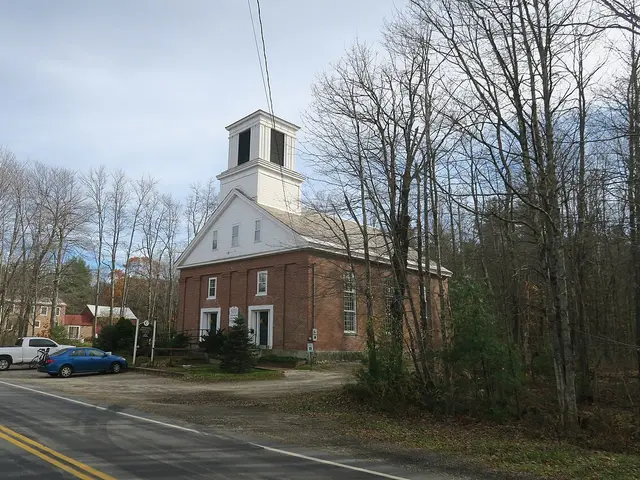 Richmond Community Church in Richmond, New Hampshire, a red brick church with a white wooden bell tower and steeple.