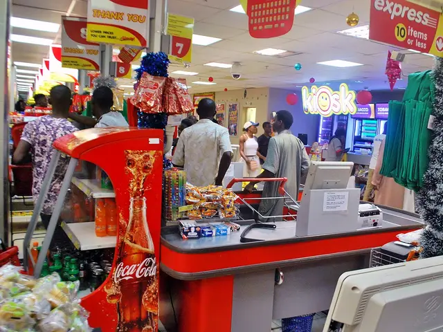 A cashier stand and checkout counter inside a grocery store.