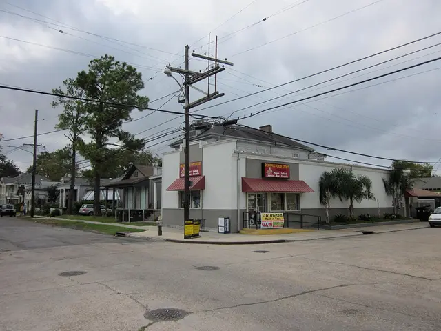 The exterior of a corner grocery store on a residential street.
