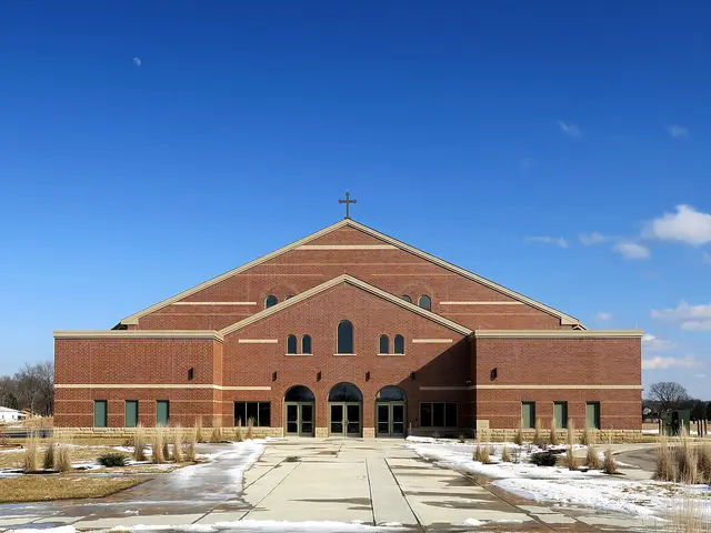 Exterior of St. John the Baptist Church in Harrison, Ohio, photographed in winter.