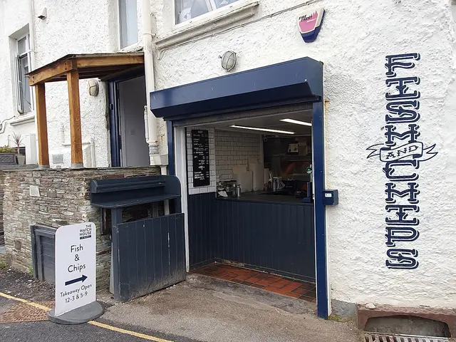 Exterior of a fish and chip takeaway shop in a seaside town.