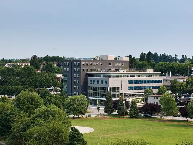 An aerial view of Vancouver Community College's Broadway Campus building surrounded by trees