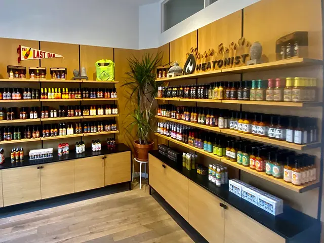 Shelves of hot sauce for sale inside the Heatonist specialty food shop in Williamsburg, Brooklyn.