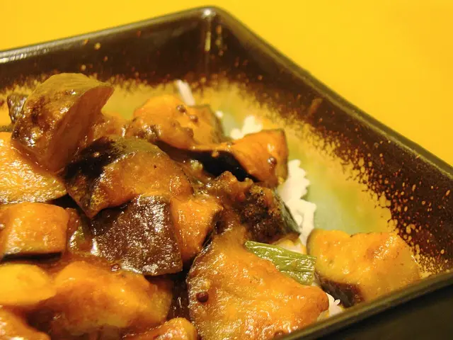 A vegan Madras-style curry made with eggplant in a spiced sauce.