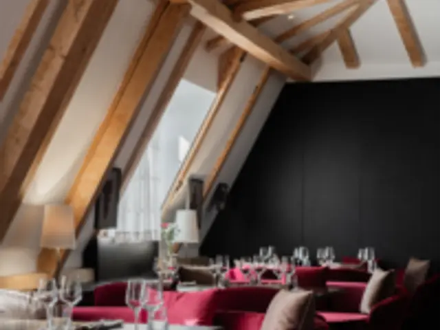 A lounge seating area inside a fine dining restaurant.