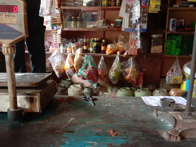 The interior of a local grocery shop with shelves of goods for sale.