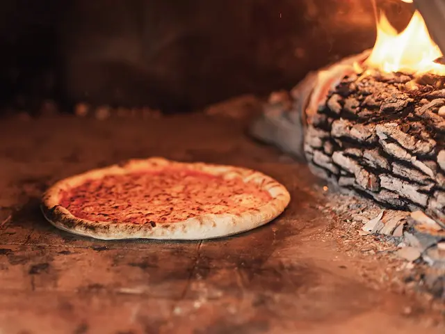 A cheese pizza baking inside a wood-fired oven.
