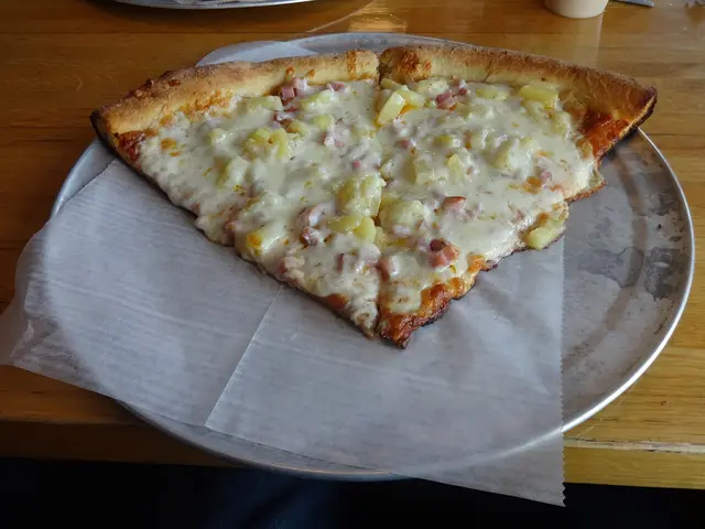 Two slices of Hawaiian-style pizza from a pizzeria in Atlanta.