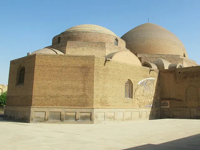 A mosque with twin brick domes
