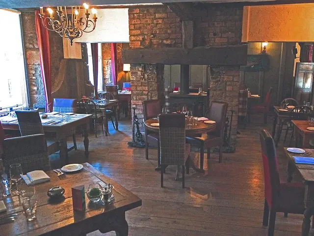 Interior dining room of the Barley Bree restaurant, with tables set for guests.