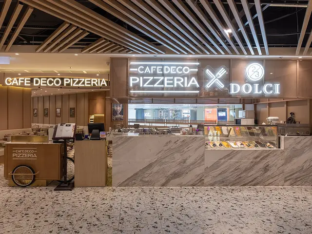 The interior dining area of a pizzeria restaurant.