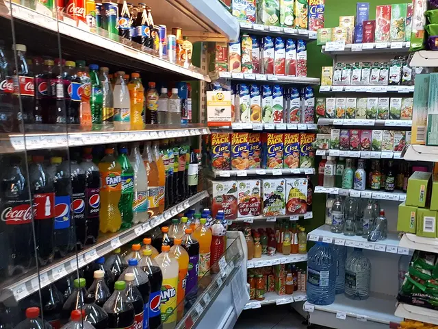 An aisle of beverages on shelves inside a grocery store in Bucharest, Romania