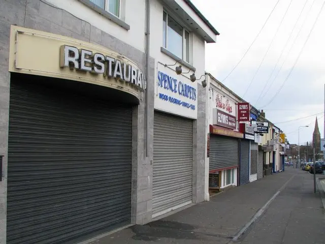 Row of fast food takeaway shopfronts on a town street.