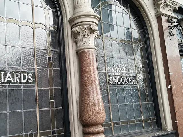 Exterior of the Half Moon Pub in Herne Hill, London, showing its stained glass windows.