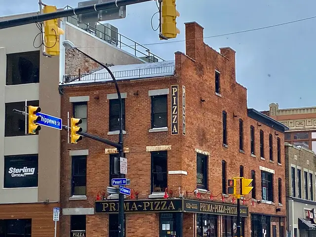 The storefront of a pizza and pasta restaurant in Buffalo, New York.