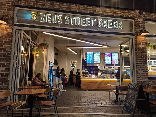 Interior of a Greek fast-casual restaurant in a shopping centre.
