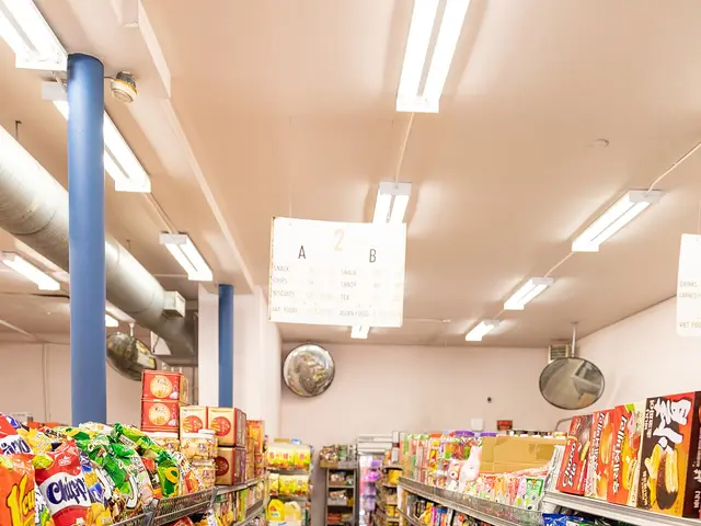 Snack food aisle in an Asian grocery store, shelves packed with colourful packaged snacks