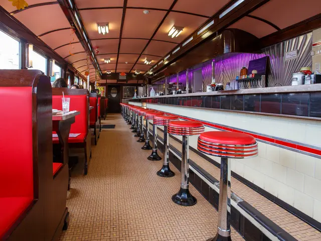 The interior of a vintage railcar-style diner.