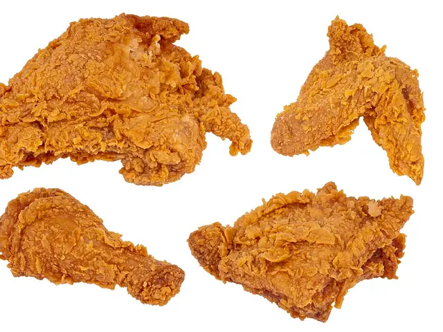A set of fried chicken pieces including a wing, thigh, leg, and breast.