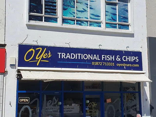 Exterior of a fish and chip shop near a town quay.