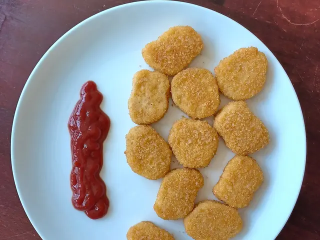 Plant-based chicken nuggets arranged on a plate.
