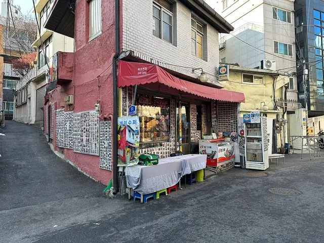 Exterior of Gaemi Supermarket ('Ant Supermarket'), a small grocery store in Seogye-dong, Seoul, South Korea.