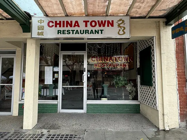 The storefront of a Chinese restaurant in a Chinatown district.