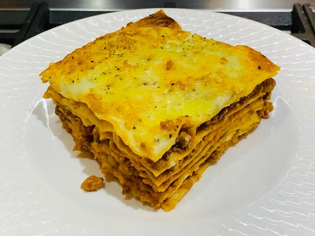 A serving of lasagna with minced meat.