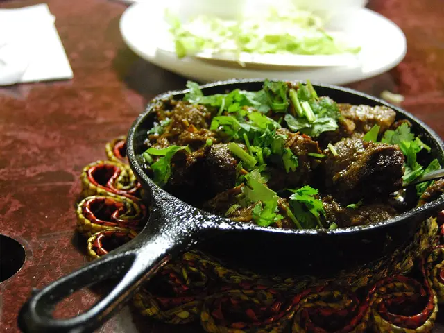 A dish of Pakistani beef karahi served at a restaurant.