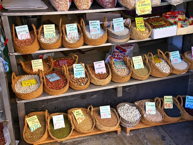 Woven baskets of dried beans and legumes for sale at a grocery store in Granada, Spain