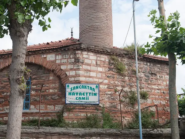 The exterior of a mosque with a minaret
