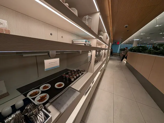 A buffet line of catered dishes at the Capital One Lounge in Dulles Airport, Virginia.