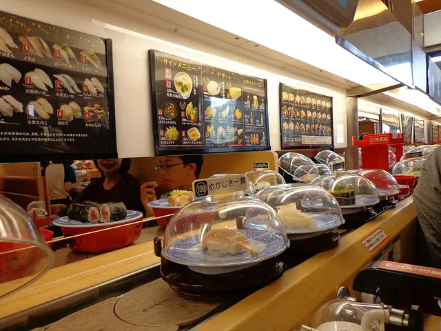 The interior of a conveyor-belt sushi (kaitenzushi) restaurant.