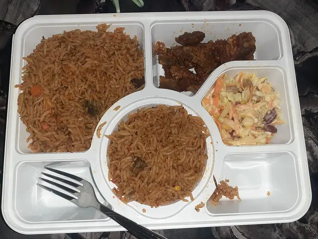 A Nigerian dish of basmati rice served with salad and assorted meat.