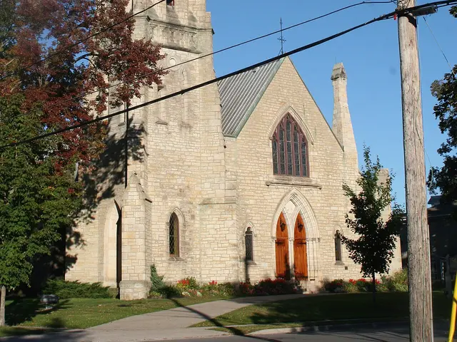 St. James the Apostle Anglican Church and rectory in Perth, Ontario, a limestone Gothic Revival church with a tall spire.
