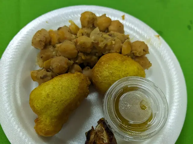 A Trinidadian plate of dates, pholourie, and channa, Caribbean dishes served for iftar.