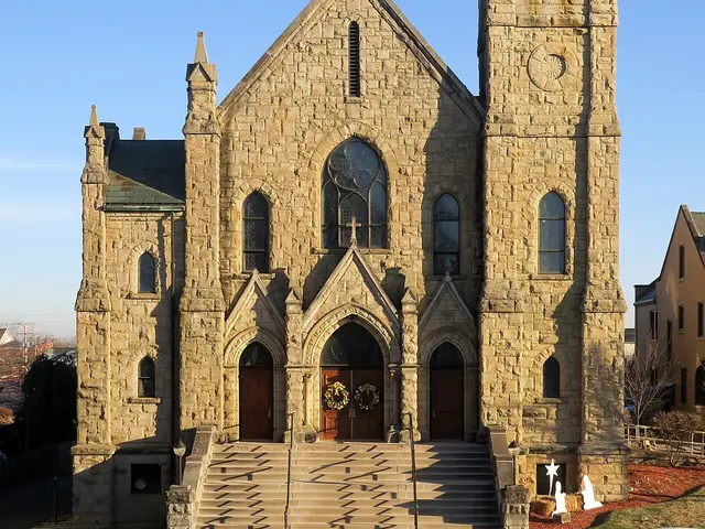 Exterior of Saint Joseph Church, a stone church building in Circleville, Ohio, viewed from across the street.