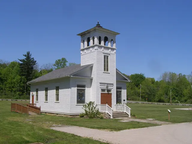 Exterior of the 1847 Frostville Village Church, a small white wooden church building.